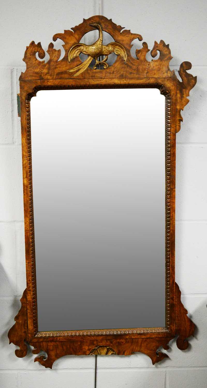 Lot 97 - A 20th Century George III style mahogany fret carved mirror