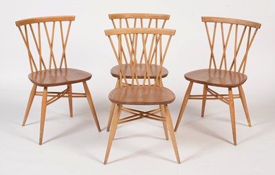Lot 857 - Ercol: a set of four Windsor latticed chairs.