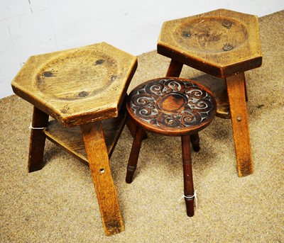 Lot 84 - Two oak milking stools and another stool
