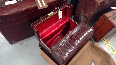 Lot 607 - Early 20th C crocodile skin travel trunk; and an alligator skin doctor's bag.