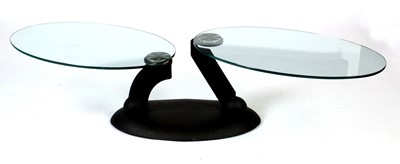 Lot 841 - Naos, Made in Italy: a plate-glass and black painted metal adjustable coffee table.