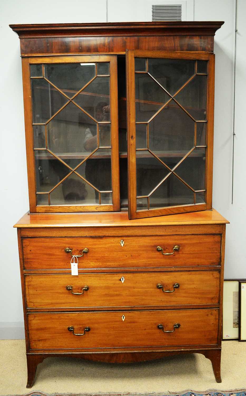 Lot 117 - An early 19th C bookcase on chest.