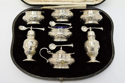 Lot 155 - An Edwardian cased silver cruet set