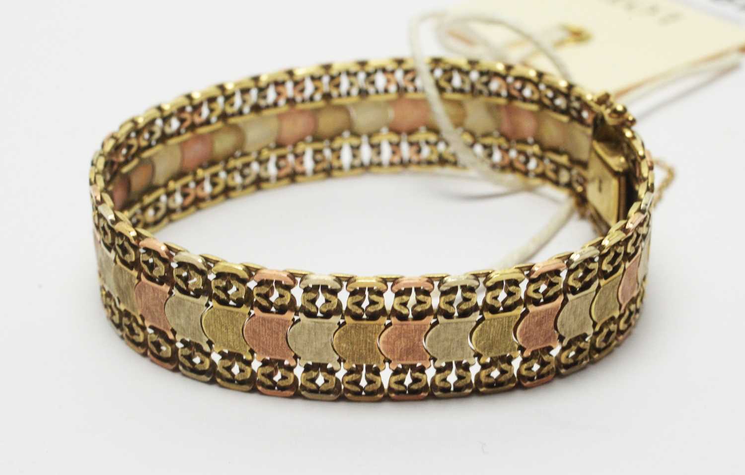 Lot 198 - A yellow, rose and white gold bracelet.