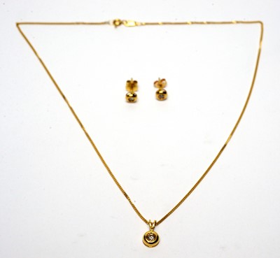 Lot 45 - A diamond pendant and earrings