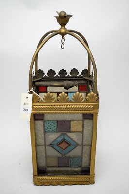 Lot 369 - A brass lantern with stained and opaque glass panels