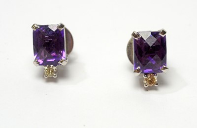 Lot 49 - Amethyst and diamond pendant and earrings