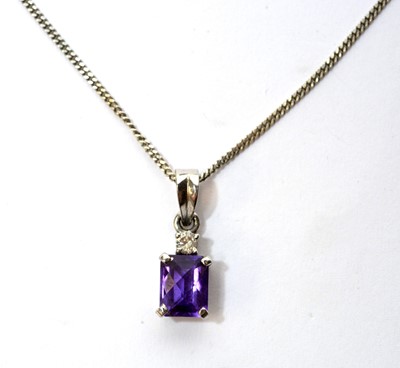 Lot 49 - Amethyst and diamond pendant and earrings