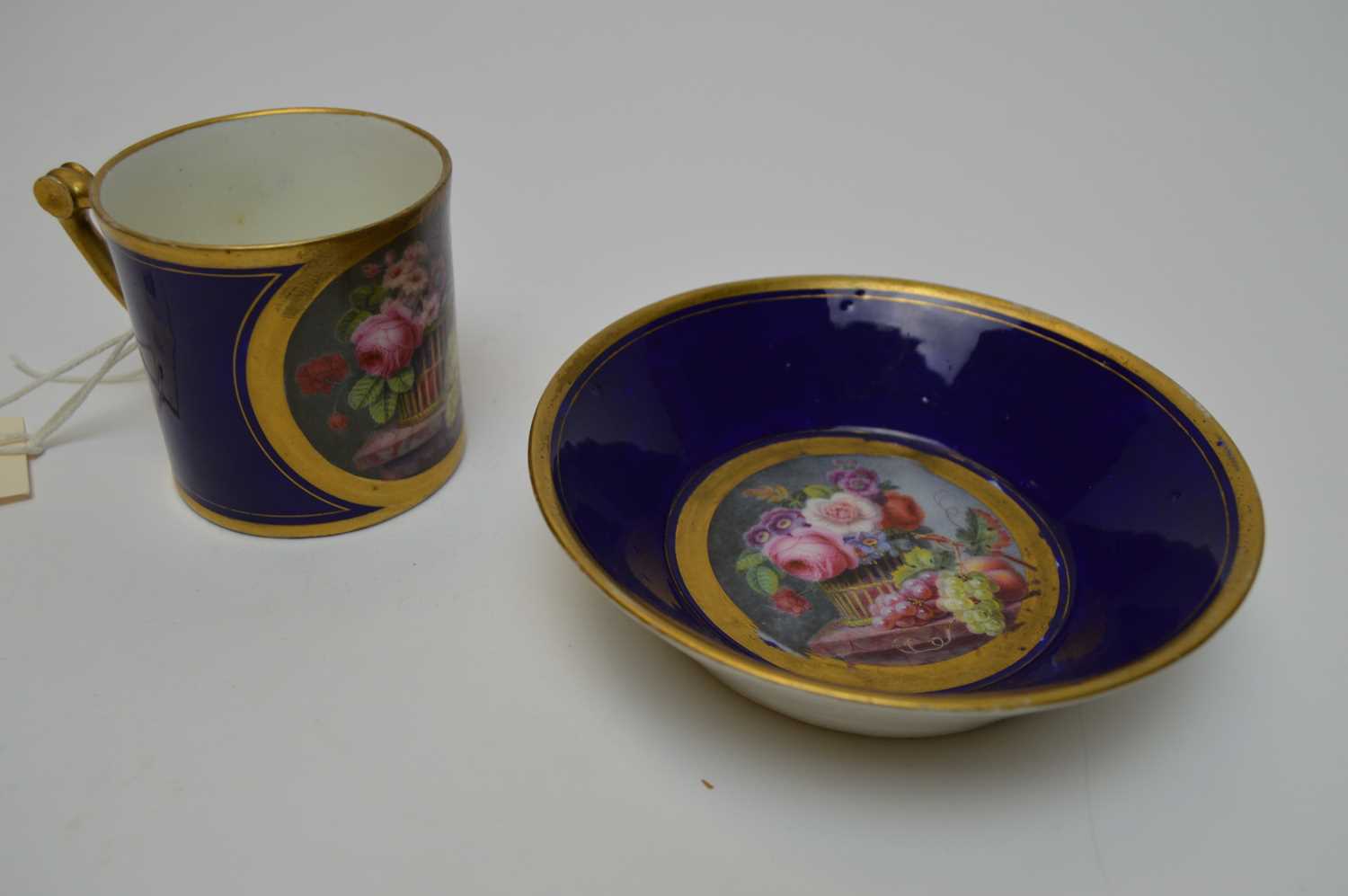 Lot 416 - A Sevra hand-painted cup and saucer