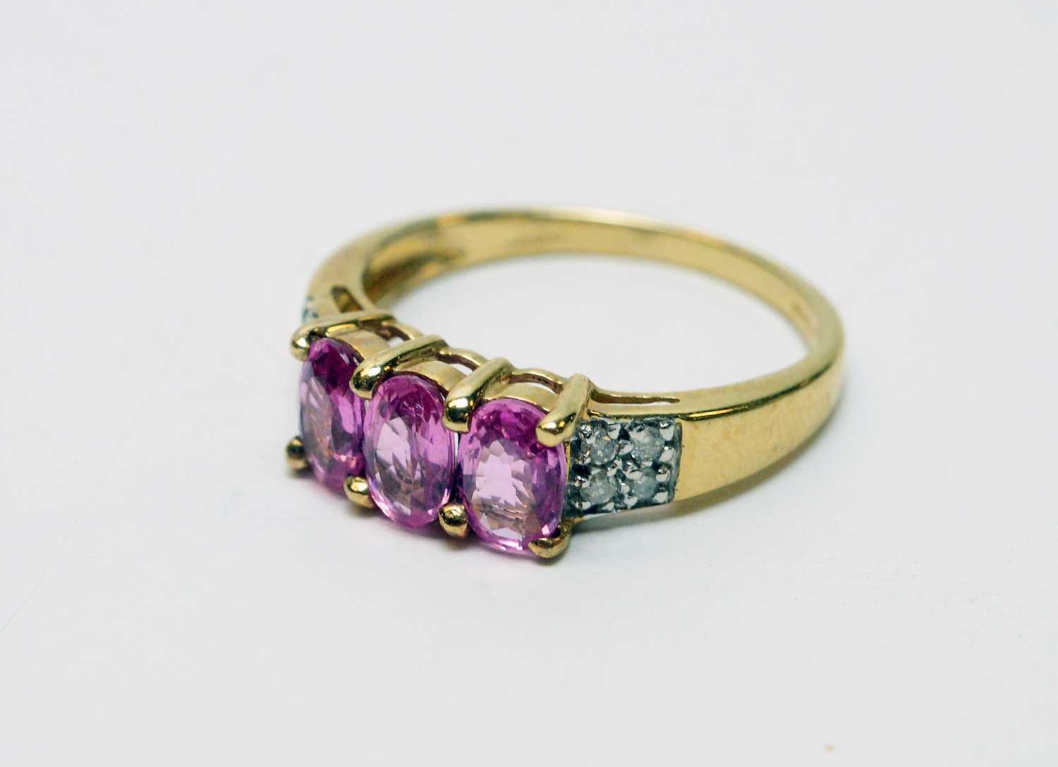 Lot 162 - Pink sapphire and diamond ring