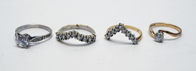Lot 171 - Four CZ or white stone rings