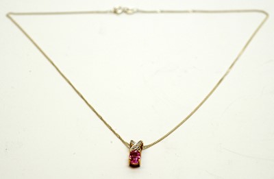 Lot 198 - A pink sapphire and dimond pendant