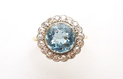 Lot 62 - An Aquamarine and diamond cluster ring