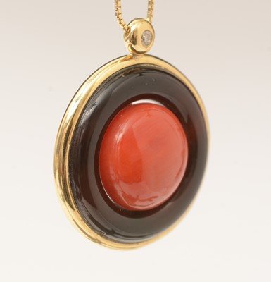 Lot 64 - A coral and onyx pendant