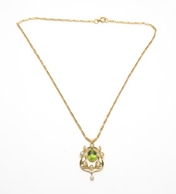 Lot 70 - An Edwardian peridot and seed pearl pendant on chain