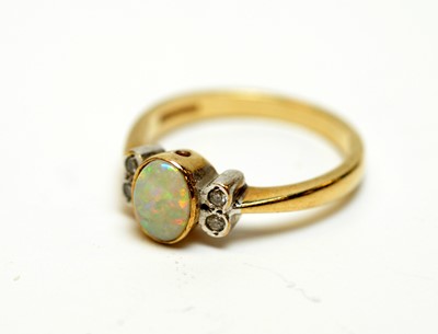 Lot 138 - An opal and diamond ring.