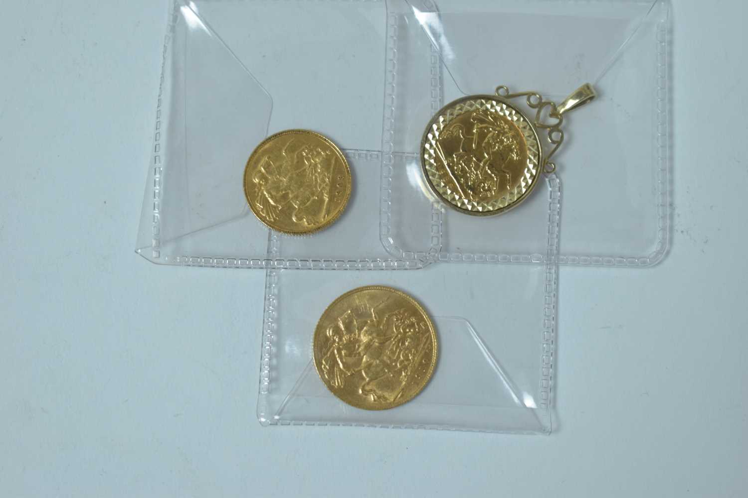 Lot 230 - Two half and one full sovereign, one in pendant mount