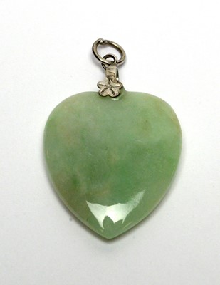 Lot 142 - Four items of jade jewellery.