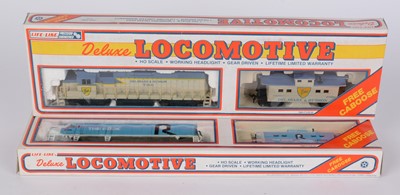 Lot 147 - Life-Like HO-gauge diesel electric locomotives and caboose