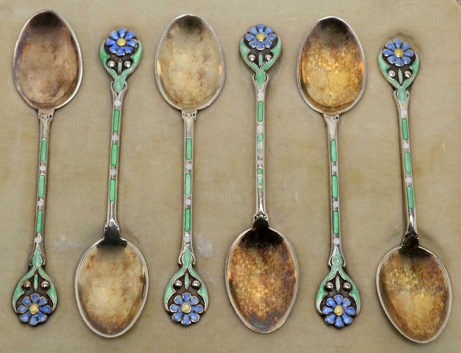 Lot 141 - Six silver-gilt and enamel coffee spoons