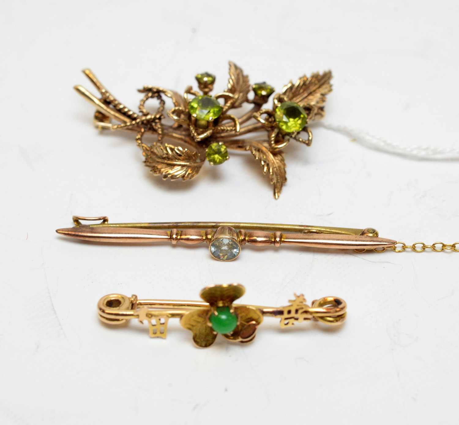 Lot 108 - Three gold and yellow-metal gem-set brooches.