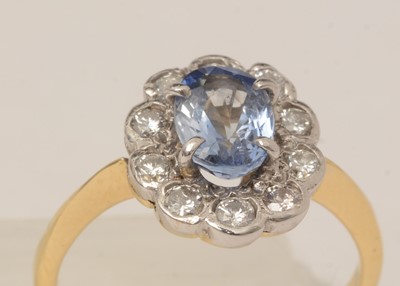 Lot 101 - A sapphire and diamond cluster ring