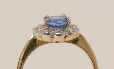 Lot 101 - A sapphire and diamond cluster ring