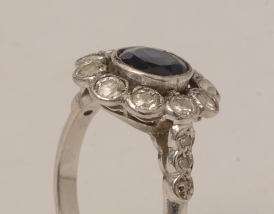 Lot 105 - A sapphire and diamond cluster ring