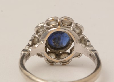 Lot 105 - A sapphire and diamond cluster ring