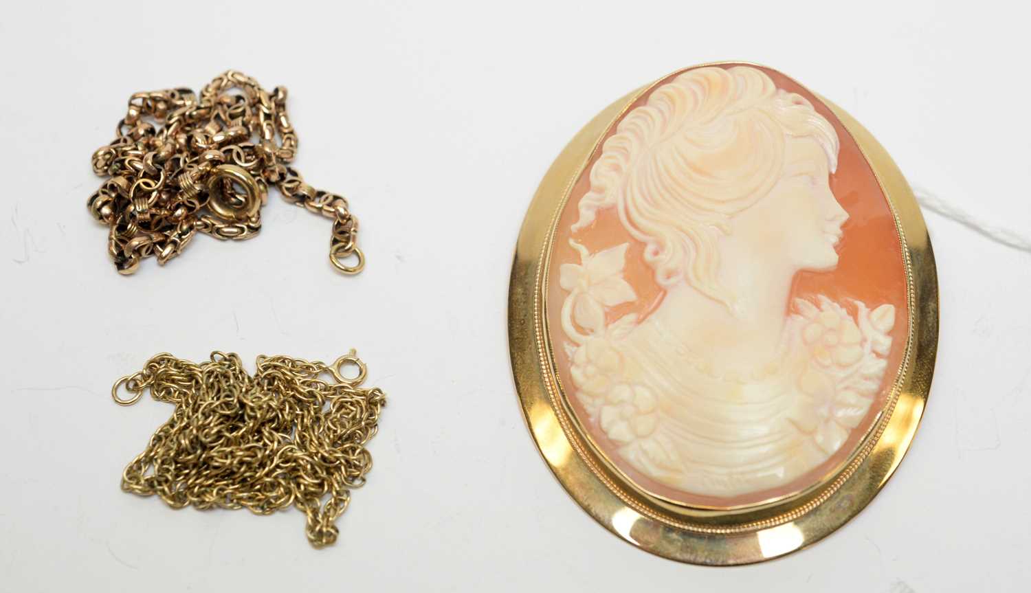 Lot 3 - A 9ct gold cameo pendant brooch and chains.