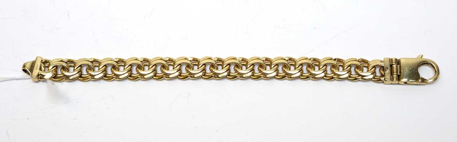 Lot 30 - A 9ct gold double curb-link bracelet.