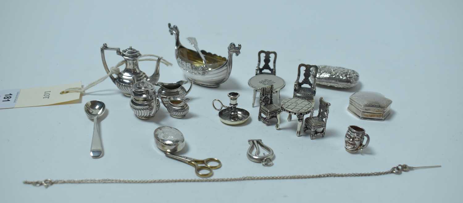 Lot 181 - A collection of silver miniature novelties, including a four piece tea service.
