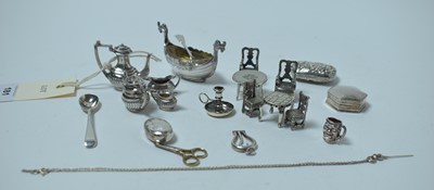 Lot 181 - A collection of silver miniature novelties, including a four piece tea service.