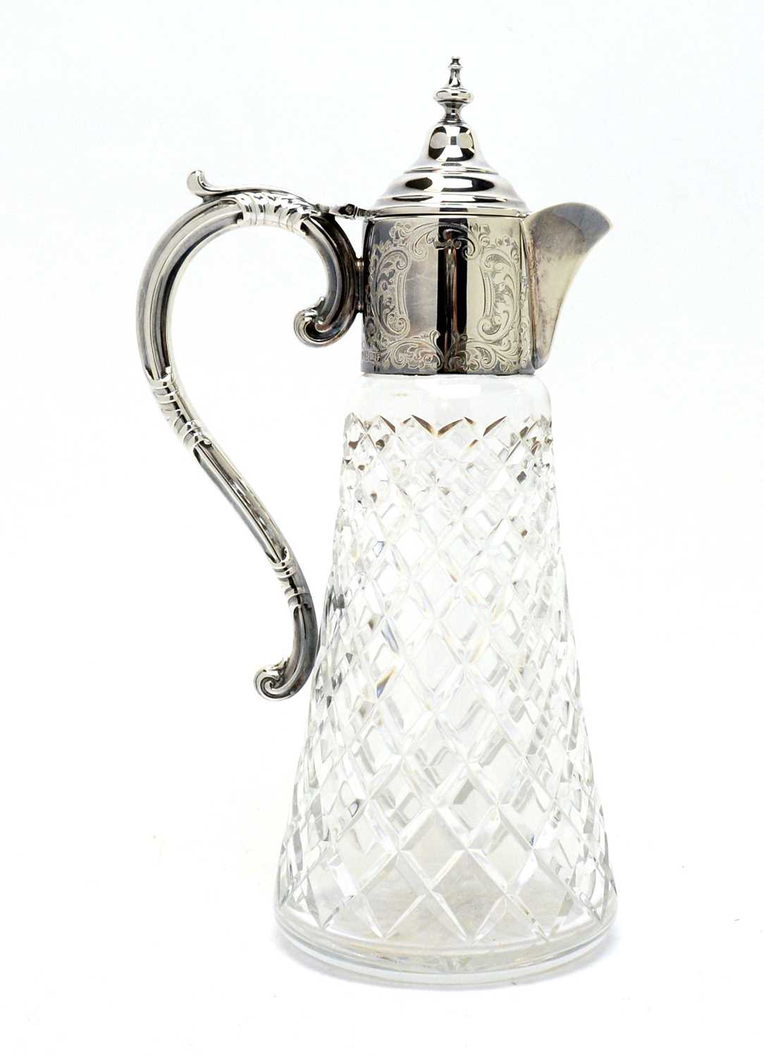 Lot 199 - A silver mounted cut glass claret jug