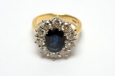 Lot 108 - A sapphire and diamond cluster ring