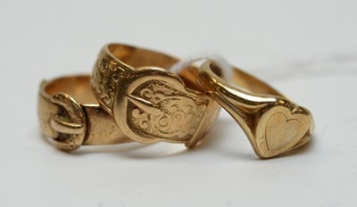 Lot 148 - A lady's 9ct gold heart-shaped signet ring; and two gold belt buckle rings.