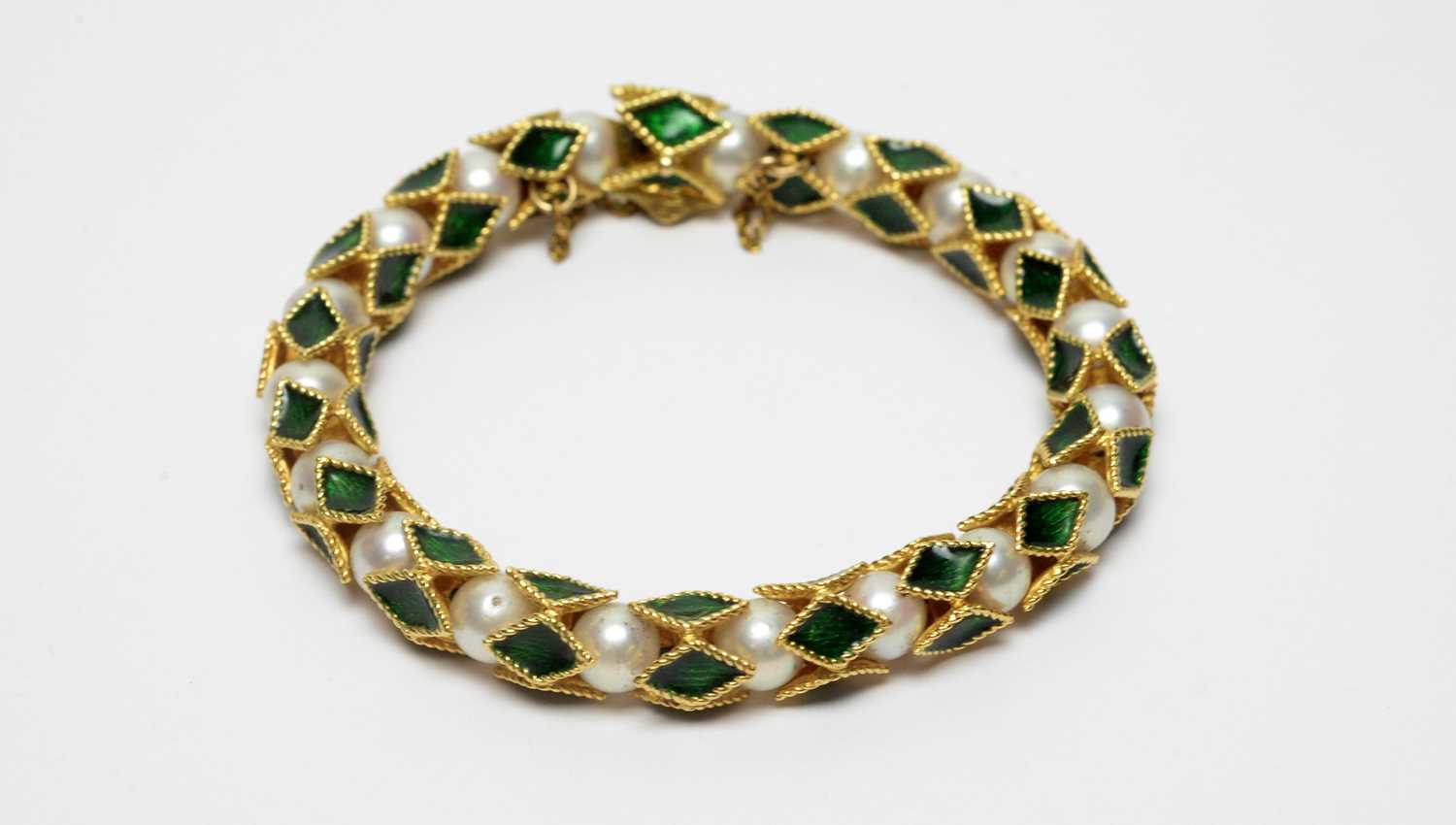 Lot 9 - An enamel and cultured pearl bracelet