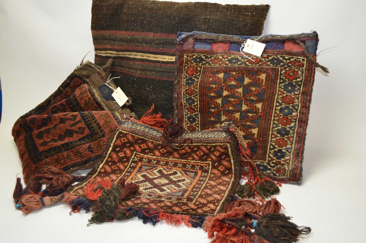 Lot 286 - A selection of Middle Eastern saddlebags and similar pillows