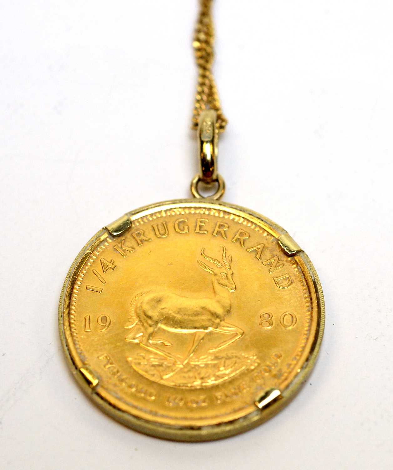 Lot 154 - A 1980 gold quarter Krugerrand held in a 9ct gold pendant mount.