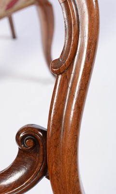 Lot 522 - A set of six Victorian carved rosewood balloon back dining chairs