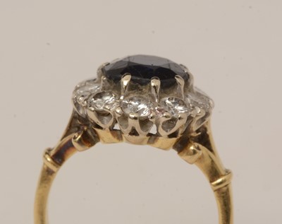 Lot 113 - A sapphire and diamond cluster ring