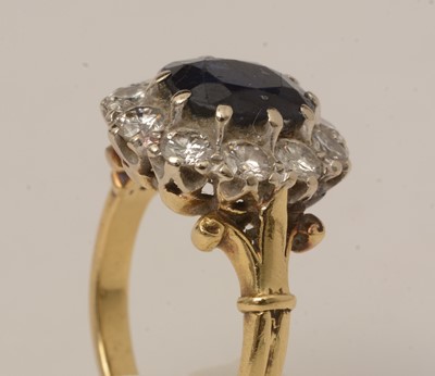 Lot 113 - A sapphire and diamond cluster ring