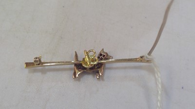 Lot 116 - A diamond set terrier pattern bar brooch