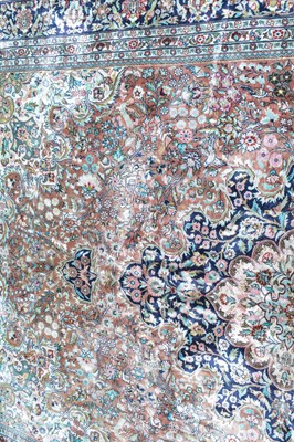 Lot 394 - A silk Kashan carpet