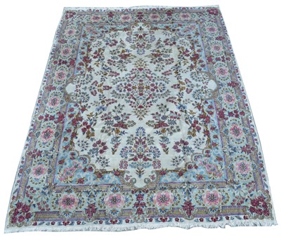 Lot 413 - An antique Kirman carpet