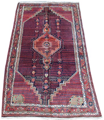 Lot 416 - An antique Malayer carpet
