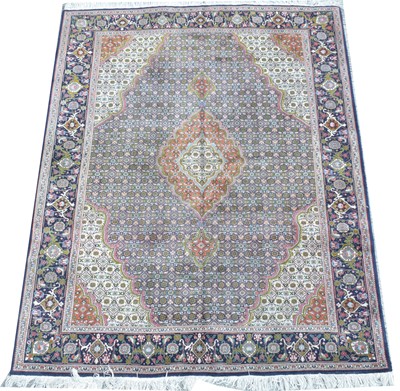 Lot 428 - A Tabriz rug