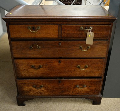 Lot 126 - A late George III oak chest of drawers.