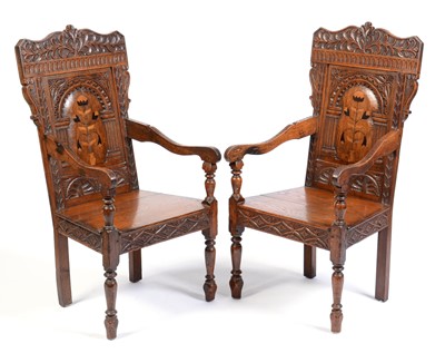 Lot 657 - Pair of Victorian oak wainscot style armchairs
