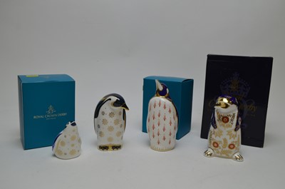Lot 301 - Three Royal Crown Derby penguin paperweights and another